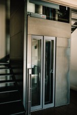 Porta telescopica vetrata